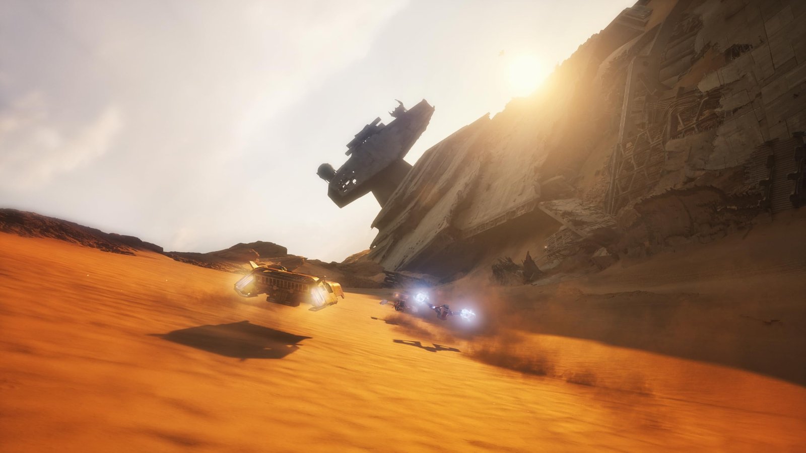 Star Wars Galactic Racer - podracers speeding through a desert canyon at sunset - fivestaredition.com