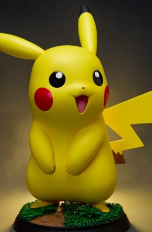 Sideshow Pikachu Life-Size Figure - front view of the smiling polystone Pikachu statue on its grassy base - fivestaredition.com